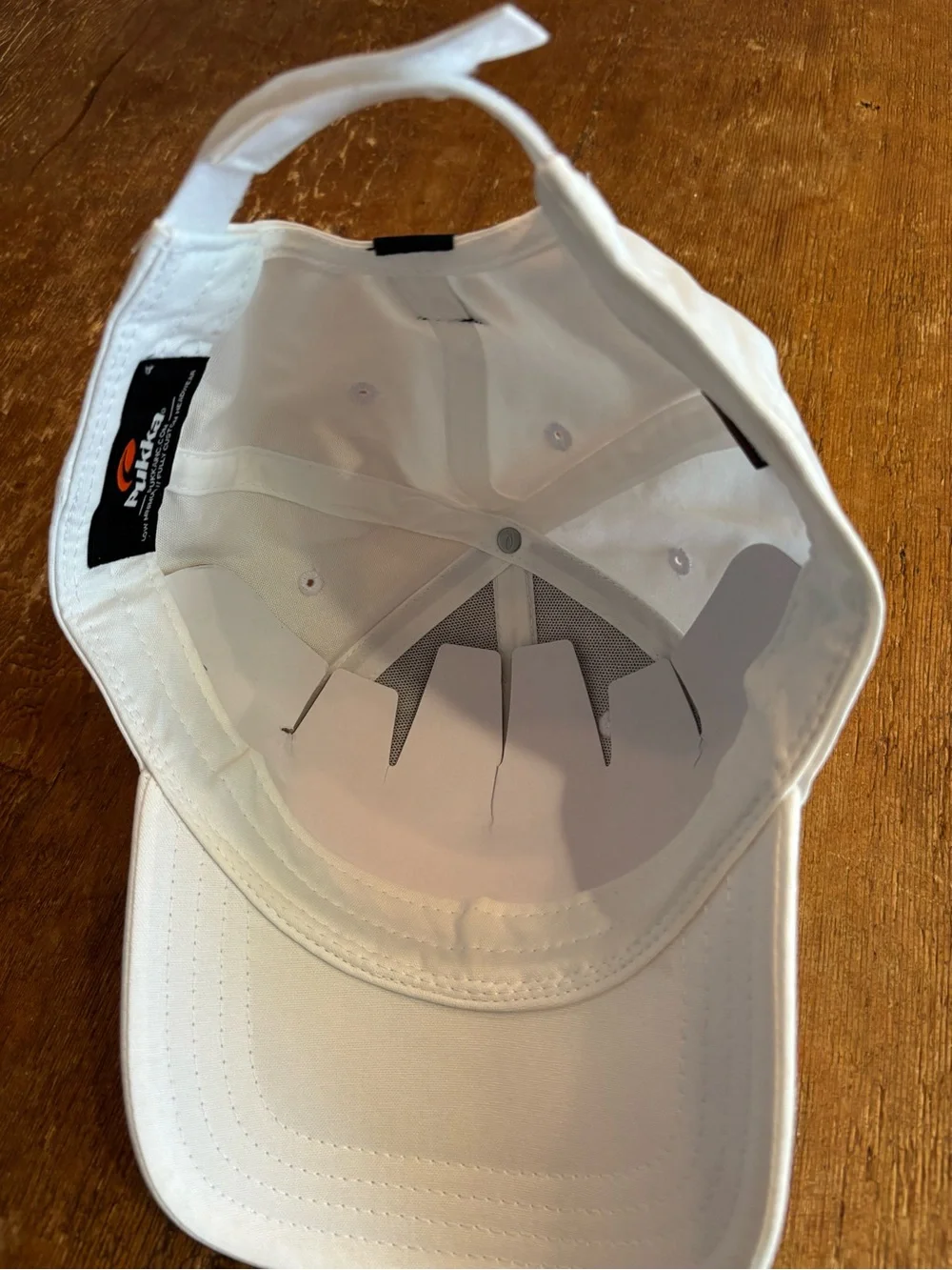 Men’s white golf hat with Grand Traverse Resort logo and year 1985 in dark green
